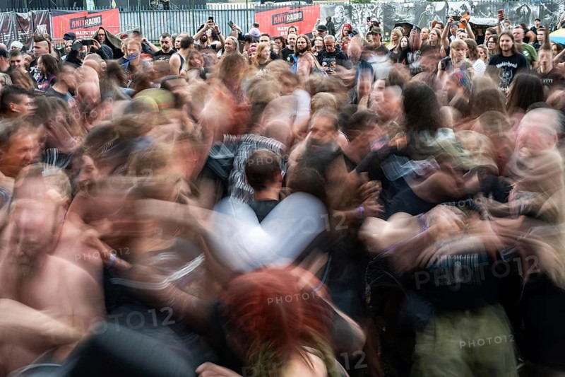 JAROCIN, POLAND - JULY 18, 2025: Jarocin Festival 2025 with rock music. Fans dance the pogo in front of the stage. Intentional blurred motion