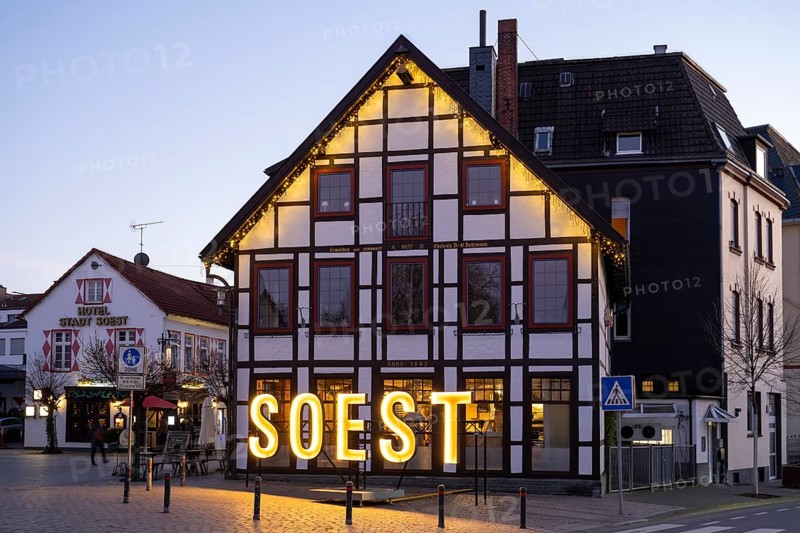 Letters form the word Soest in front of a half-timbered house, Blue Hour, Soest, North Rhine-Westphalia, Germany