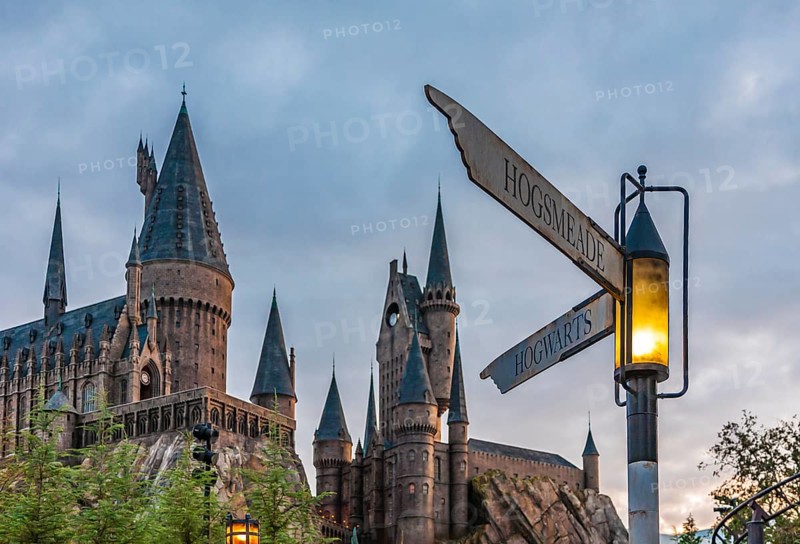 Street signs at corner of Hogsmeade and Hogwarts in front of castle in The Wizarding World of Harry Potter at Universal Studios in Orlando, Florida, USA