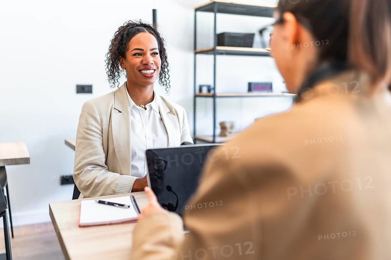 Businesswomen engaging in a productive meeting, fostering collaboration and achieving professional goals