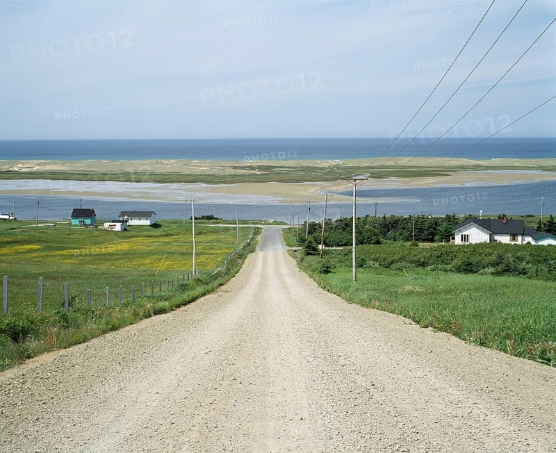 Steep gravel road on Grosse Ile in summer, Magdalen Islands, Quebec, Canada