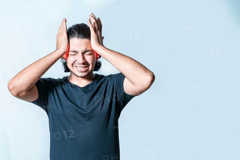 Suffering person with migraine massaging head isolated. Headache and migraine concept