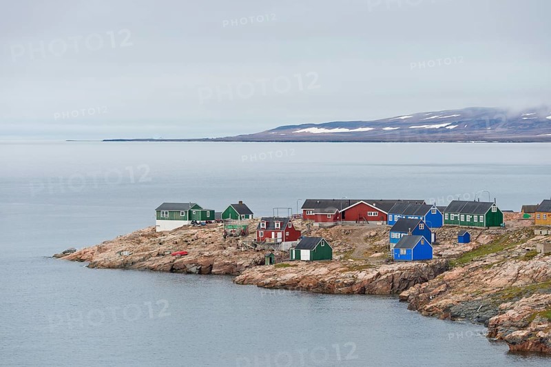 Colourful houses on a rocky coastal landscape, remote Arctic Inuit settlement Ittoqqortoormiit, Scoresbysund or Scoresby Sund or Greenlandic Kangertittivaq, East Greenland, Greenland