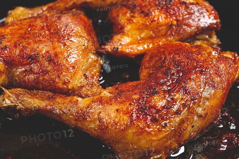 Baked chicken legs, with crispy skin, served in a pan, rustic style, homemade, no people
