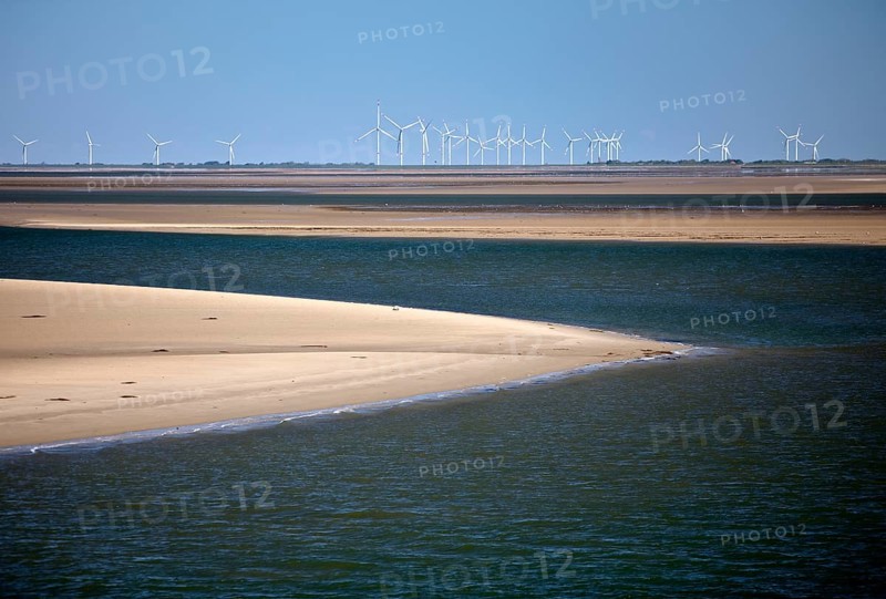 Schleswig-Holstein Wadden Sea National Park with sandbanks and wind turbines on the mainland, North Frisia, Germany
