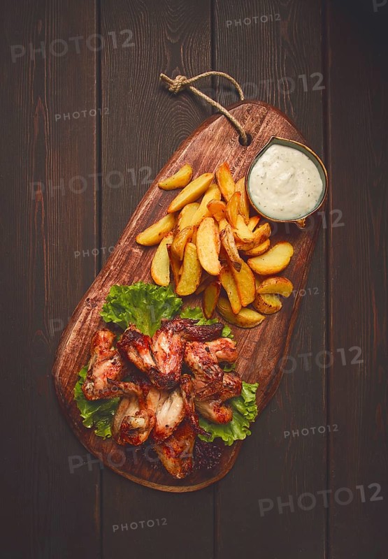 Fried chicken wings, with potatoes, and spices, homemade, fast food, no people