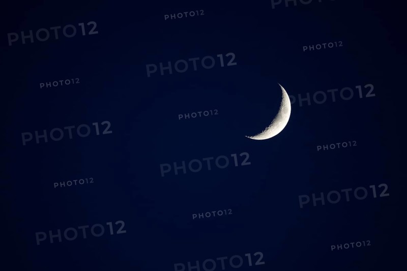 Evening sky with crescent moon, Germany