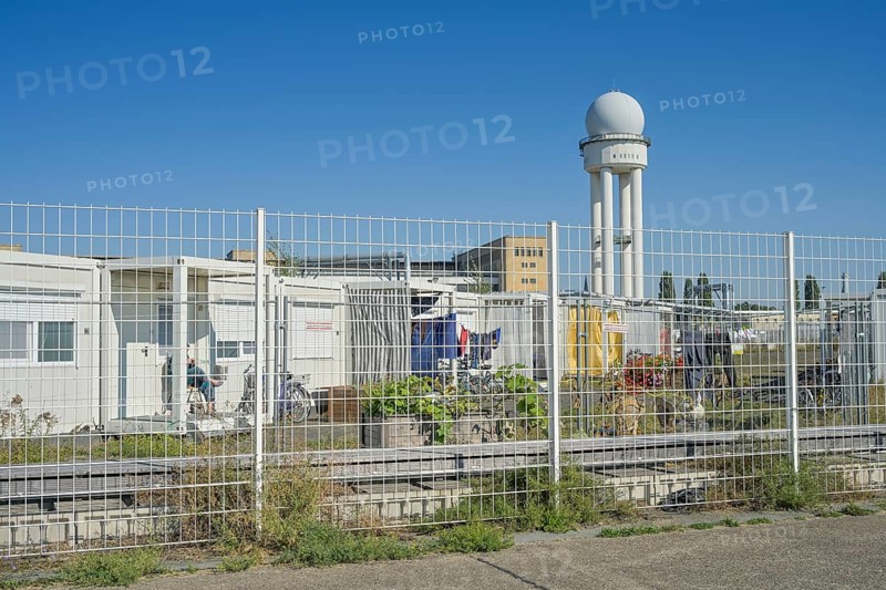 Container village, refugee accommodation, radar tower, fences, Tempelhof Airport, Tempelhofer Feld, Berlin, Germany