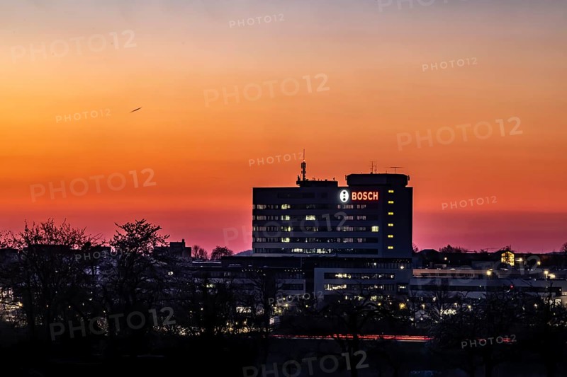 Bosch factory at sunset. Illuminated logo of the company. Schwieberdingen, Baden-Württemberg, Germany