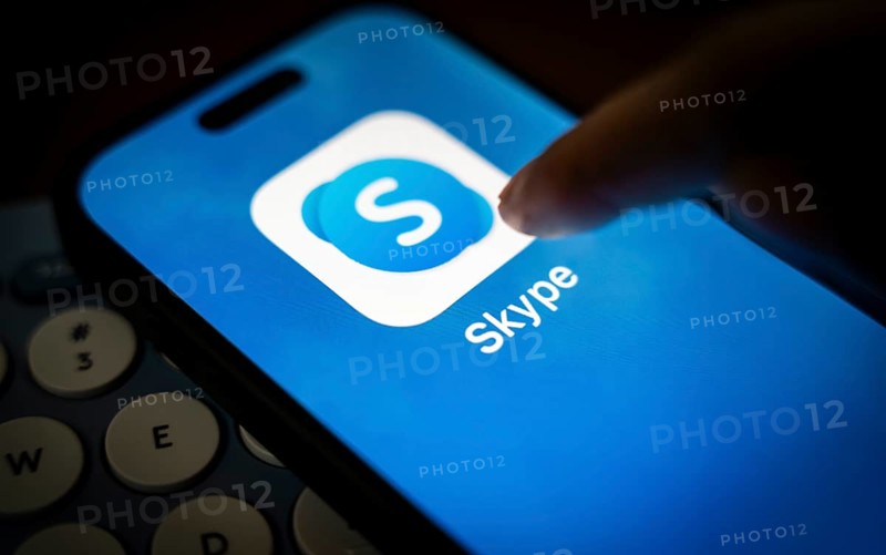 In this photo illustration, a person holds a mobile phone displaying Skype application, in Guwahati, India on 3 March 2025. Skype is shutting down in May 2025, and Microsoft is moving users to Teams