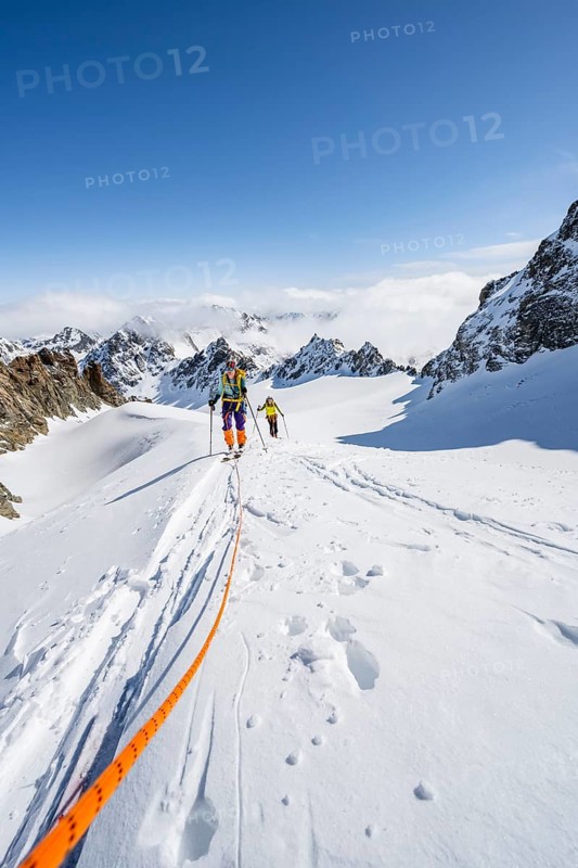 Ski tourer with rope, rope team on the Vadret da Porchabella glacier on the ascent to the summit of Piz Kesch, mountain landscape in winter, alpine tour, ski tour Bündner Haute Route, Albula Alps, Rhaetian Alps, Grisons, Eastern Switzerland, Switzerland