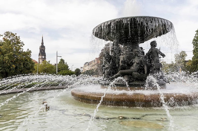 Fountain Stille Wasser by Robert Diez on Albertplatz, in the background the Dreikönigskirche, Dresden, Saxony, Germany