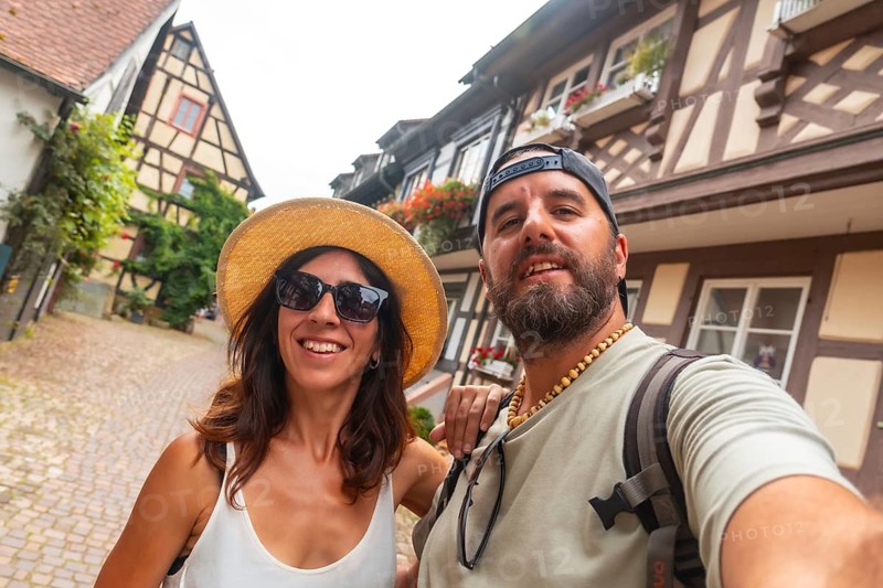 Selfie of a couple in the medieval village in the old town of Gengenbach in the Black Forest, Germany, family vacation concept