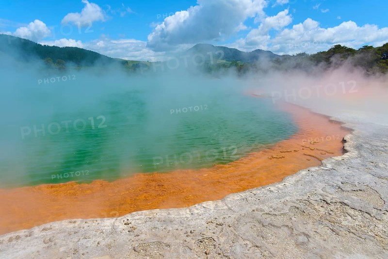 Hot spring with steam surrounded by a picturesque landscape, Champagne Pool thermal lake, Wai-O-Tapu Thermal Wonderland, Rotorua, North Island, New Zealand