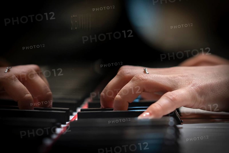 Hand of a young pianist playing on the keyboard of a Steinway & Sons grand piano, Stuttgart, Baden-Württemberg