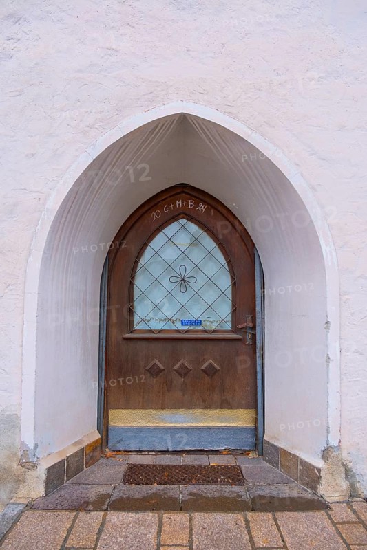 View of the entrance door of the pilgrims' house, St. Lorenzen, Bolzano, Trentino, South Tyrol, Italy of the parish church of St. Lawrence, St. Lorenzen, Bolzano, Trentino, South Tyrol, Italy