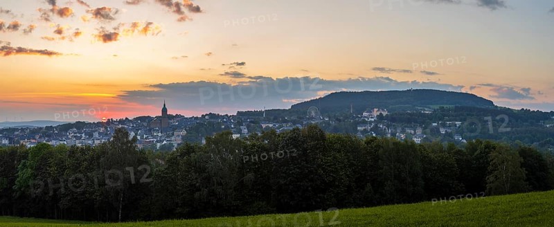 Panorama of the sunrise over Annaberg-Buchholz and Pöhlberg, Erzgebirge, Saxony, Germany