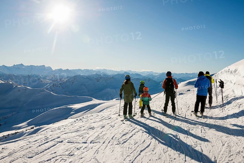 Snowy mountain landscape and skiers, Damüls, Bregenzerwald, Vorarlberg, Austria