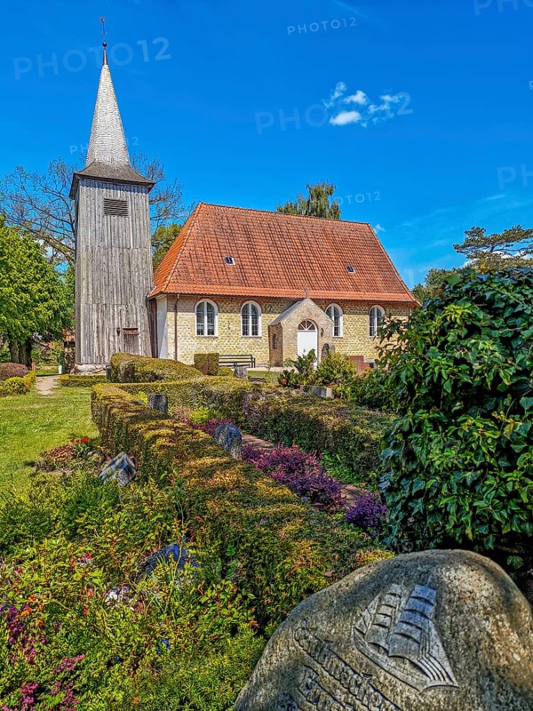 Arnis skipper's church with cemetery, brick church with wooden tower, sailor's gravestone with two-master, the smallest town in Germany, sunshine, blue sky, landscape Angeln, Schleswig-Holstein, Germany