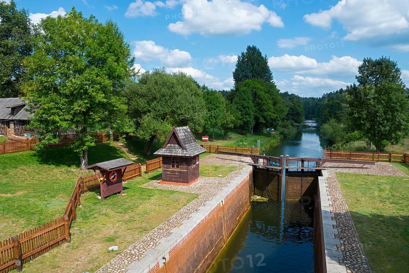 Lock with neighbouring river, surrounded by trees and blue sky with clouds, Mikaszówka lock, Kanal Augustowski, Augustów canal, Augustow, canal, Mikaszówka, Mikaszowka, Powiat Augustowski, Podlaskie Voivodeship, Poland