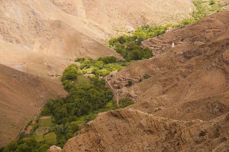 River valley with small fields and village with Berber mud houses, Ait Bouguemez Valley, High Atlas, Morocco