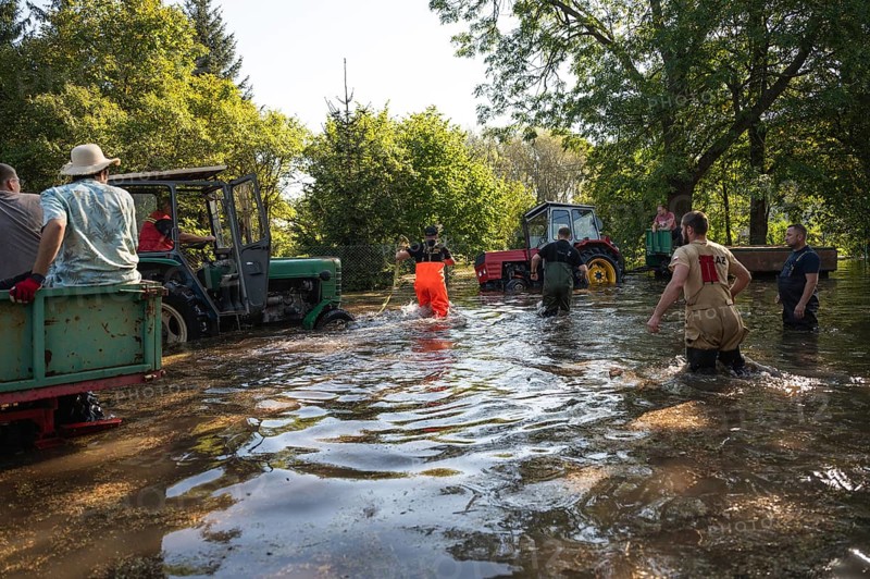 SCINAWA. POLAND - SEPTEMBER 21, 2024: Flood caused by heavy rainfall and river overflowing. Residents help their neighbors.