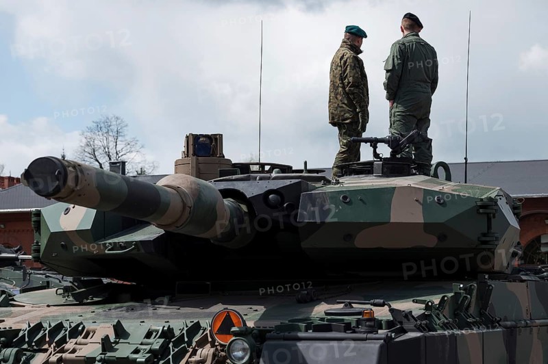 Soldiers on the top of tank.