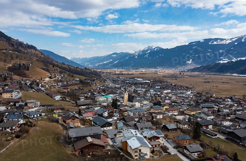 Drone shot, view of village with parish church, Piesendorf, Pinzgau, Salzburg province, Austria