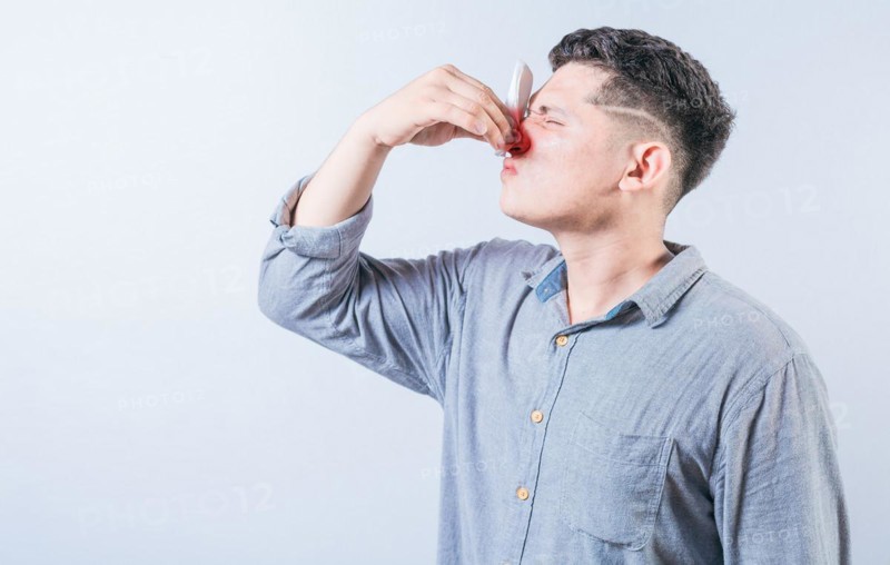 Portrait of person with nasal congestion isolated. People suffering with irritated nose isolated
