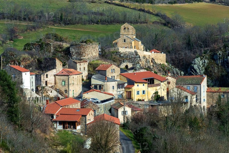 View on Saint-Herent village and his romanesque church. Puy de Dome. Auvergne-Rhone-Alpes. France