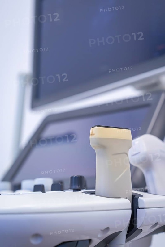 Medical ultrasound probe in front of a screen in a clinical environment, Urology, Germany