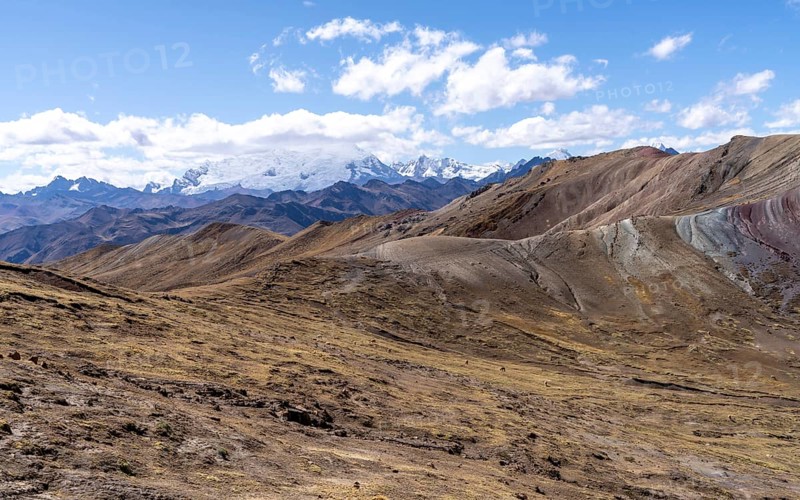 View from Palccoyo to cloudy snow-capped mountains, barren landscape, Peruvian Andes, Checacupe district, Cusco, Peru