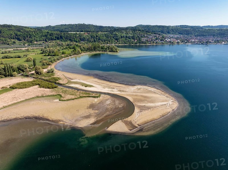 Aerial view of the mouth of the Stockacher Aach at low water, which flows into Lake Überlingen. The sedimentation of the suspended matter and sediment carried by the tributary is gradually silting up the shore zone near Bodman-Ludwigshafen. Lake Constance, district of Constance, Baden-Württemberg, Germany
