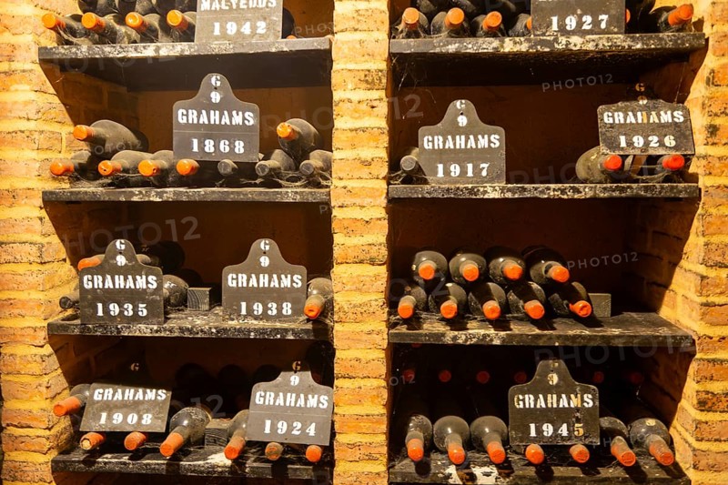 Vintage port wine bottles in cellar of Graham's port wine lodge, Vila Nova de Gaia, Porto, Portugal