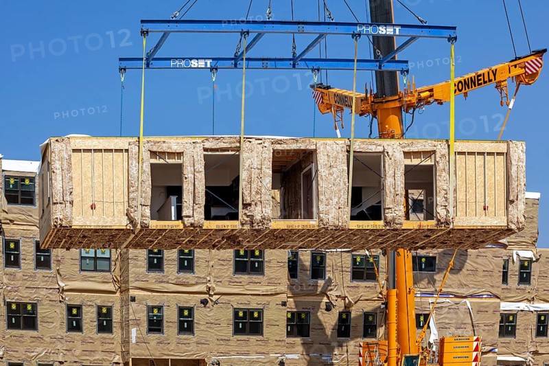 Detroit, Michigan - Workers use modular construction methods to build apartments for low to moderate income households. Each module is put together off site by Ginosko Modular