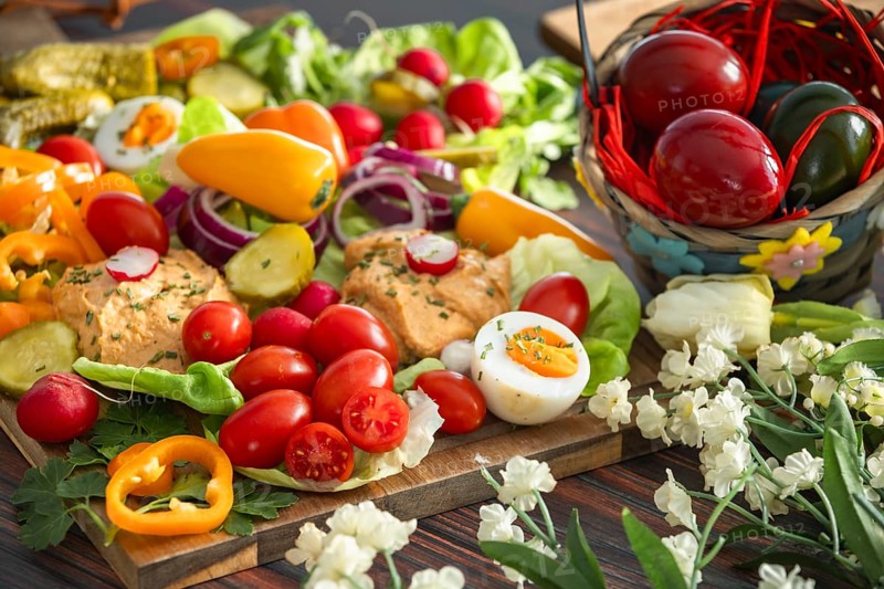 Vegetarian snack for Easter, hummus, fresh vegetables, eggs and pastries