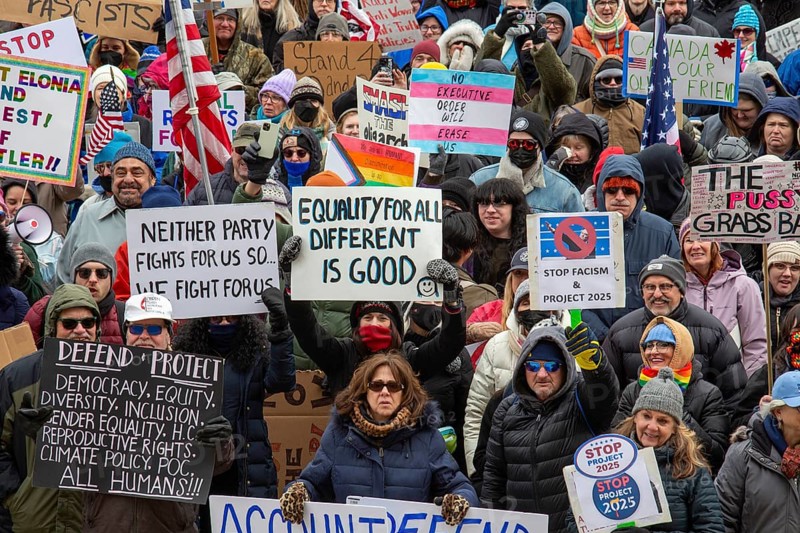 Lansing, Michigan USA - 5 February 2025 - People rally at the Michigan state capitol to oppose President Trump, Elon Musk, and Project 2025. Similar rallies were planned across the country, many of them at state capitols