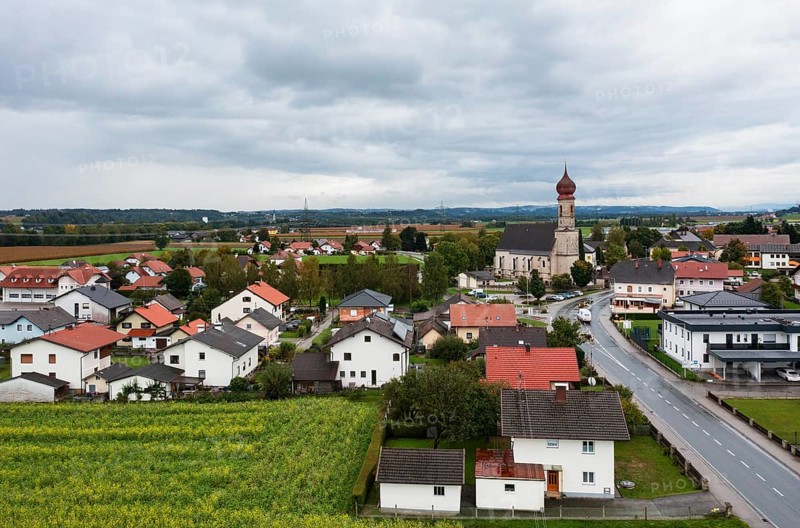 Drone shot, view of village with church, Burgkirchen, Innviertel, Upper Austria, Austria