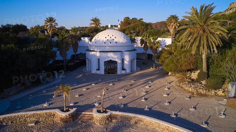 Drone shot, morning light, white dome on paved square, surrounded by palm trees in Mediterranean landscape, Kalithea, Kallithea, thermal baths, thermal baths, bathing complex, Rhodes, Dodecanese, Greek Islands, Greece