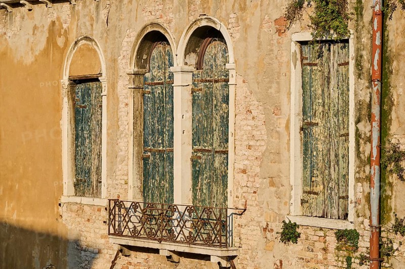 Windows of an old house in Venice on a sunny day in winter, Italy