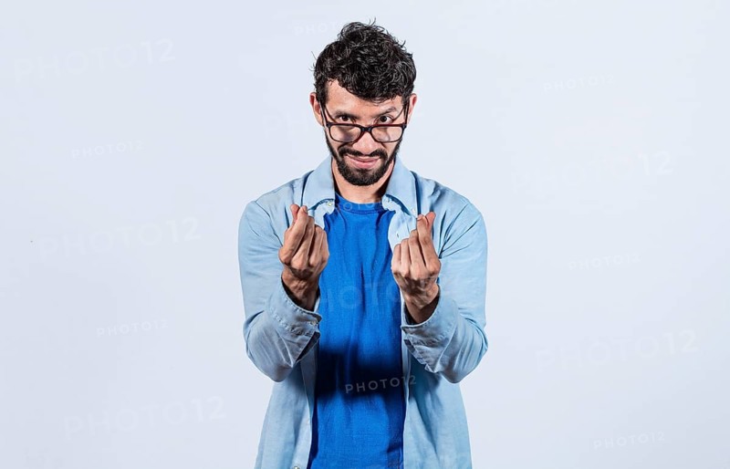 Cunning man rubbing fingers showing money gesture isolated. Gesture of man asking for money with fingers isolated