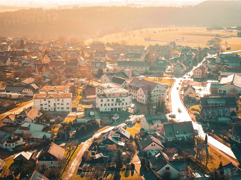 Bird's eye view of a village landscape in warm autumnal light, Neubulach, Black Forest, Germany