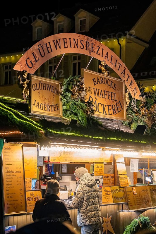 A mulled wine stall at a Christmas market at night, animated and decorated, Christmas market Ludwigsburg, Germany