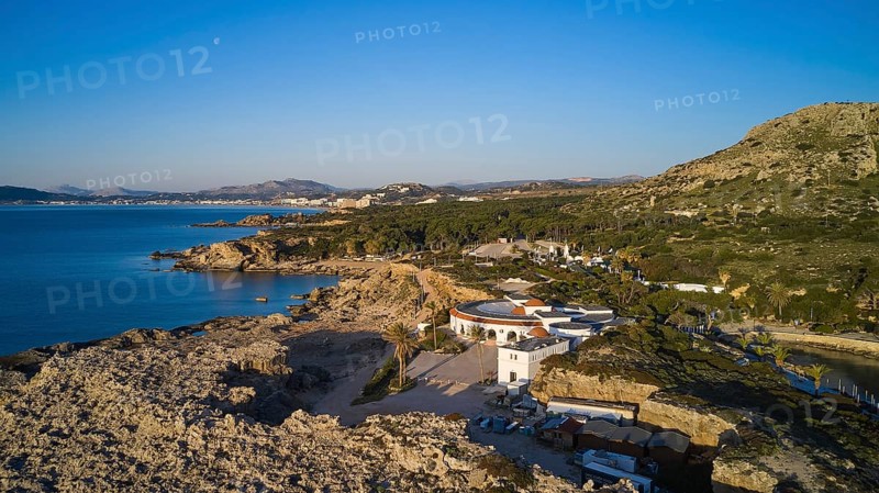 Drone shot, morning light, view of the coast and a circular building in a Mediterranean landscape, mountains and sea in the background, Kalithea, Kallithea, thermal baths, spa, Rhodes, Dodecanese, Greek Islands, Greece