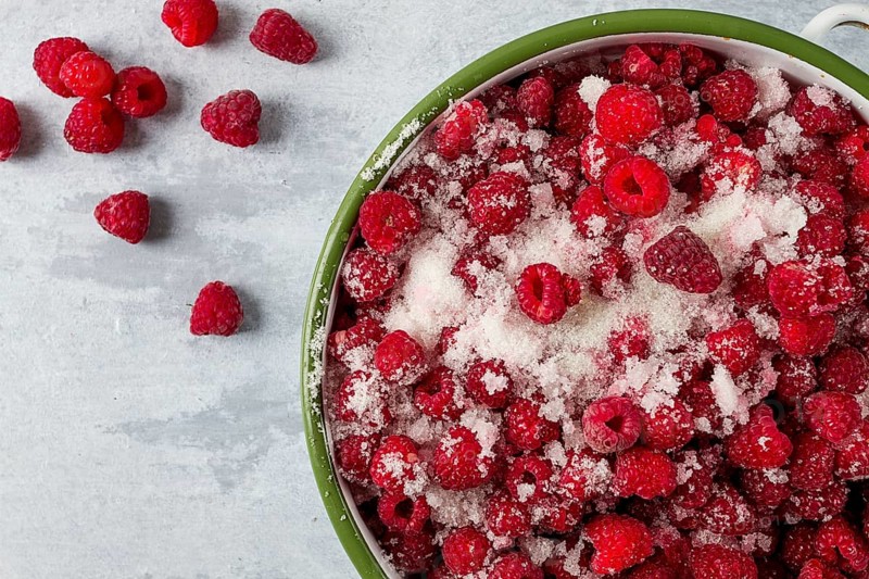 Fresh raspberry berry, covered with granulated sugar, jam preparation, top view, no people