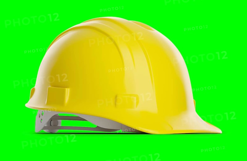 Yellow construction hard hat isolated on a green screen