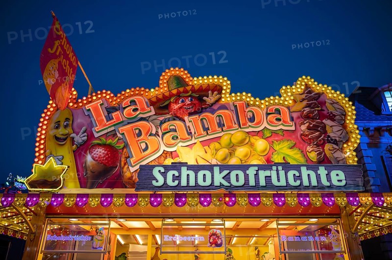Sales stand, confectionery, sweets, chocolate fruit, advertising, neon lighting, Cannstatter Wasen, blue hour, funfair, spring festival, folk festival, Bad Cannstatt, Stuttgart, Baden-Württemberg, Germany