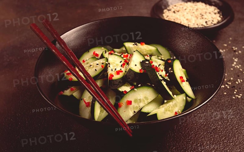 Chinese salad, cucumbers with chili pepper and sesame seeds, homemade, no people