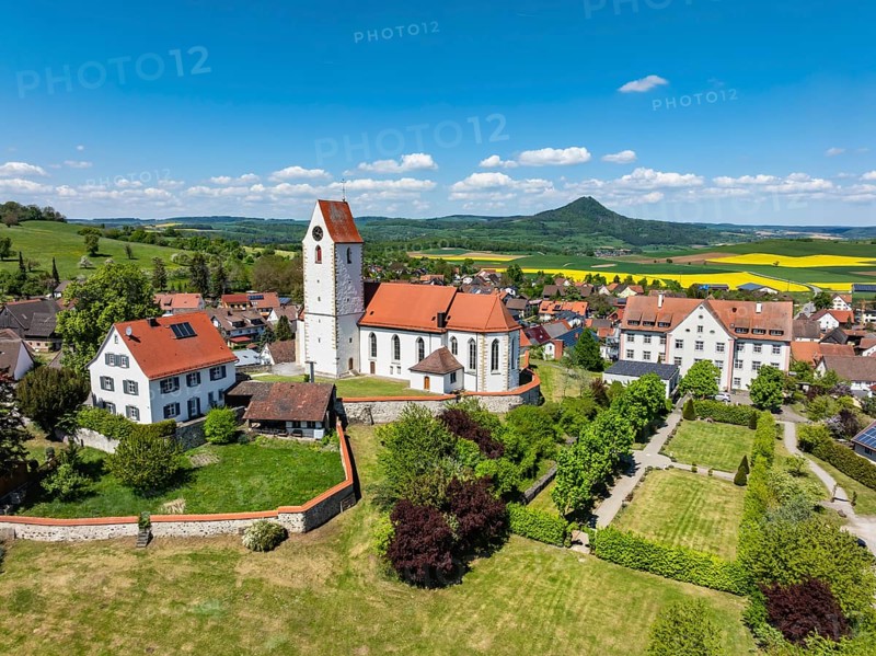 Aerial view of the municipality of Weiterdingen in Hegau with the church of St Mauritius, on the left the Hegau volcano Hohenstoffeln, on the right the Hohenhewen, district of Constance, Baden-Württemberg, Germany