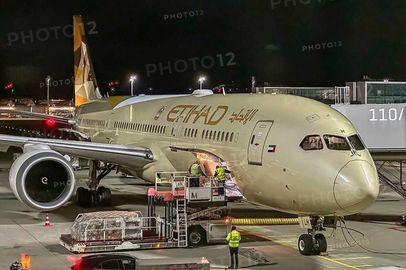 Etihad Boeing 787 aircraft at Munich Airport at night. Munich, Bavaria, Germany